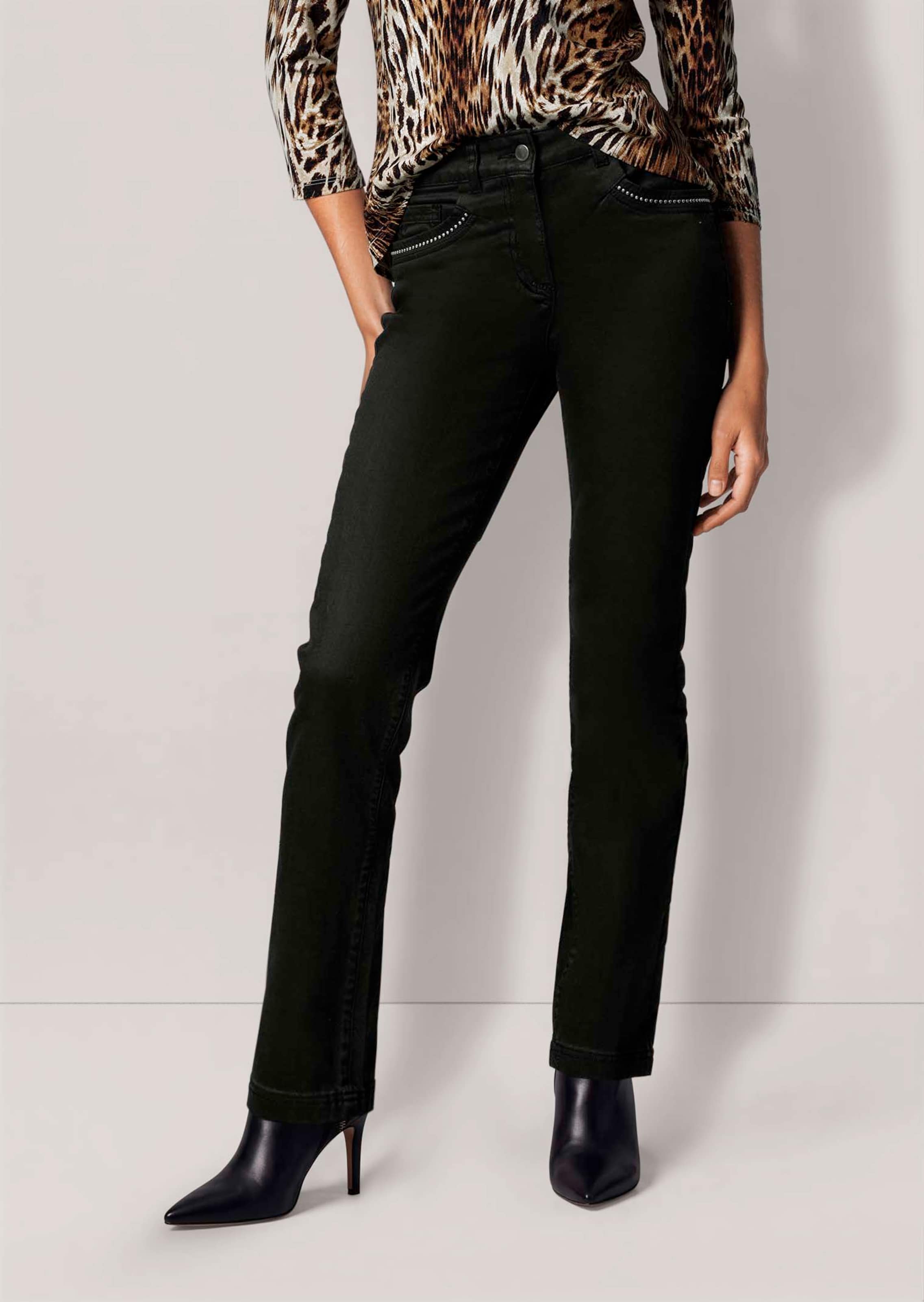Jean slim enduit avec rivets décoratifs