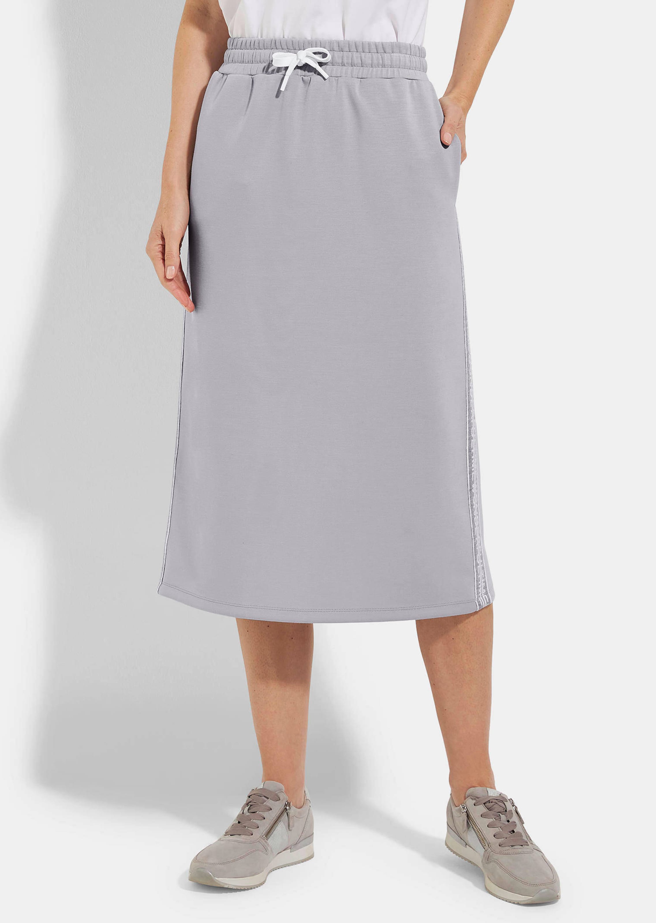 Jupe en sweat avec lien de serrage sous coulisse. En coton et élasthanne.