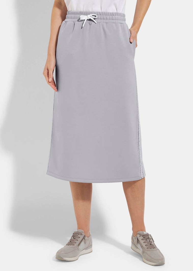 Jupe en sweat avec lien de serrage sous coulisse. En coton et élasthanne.