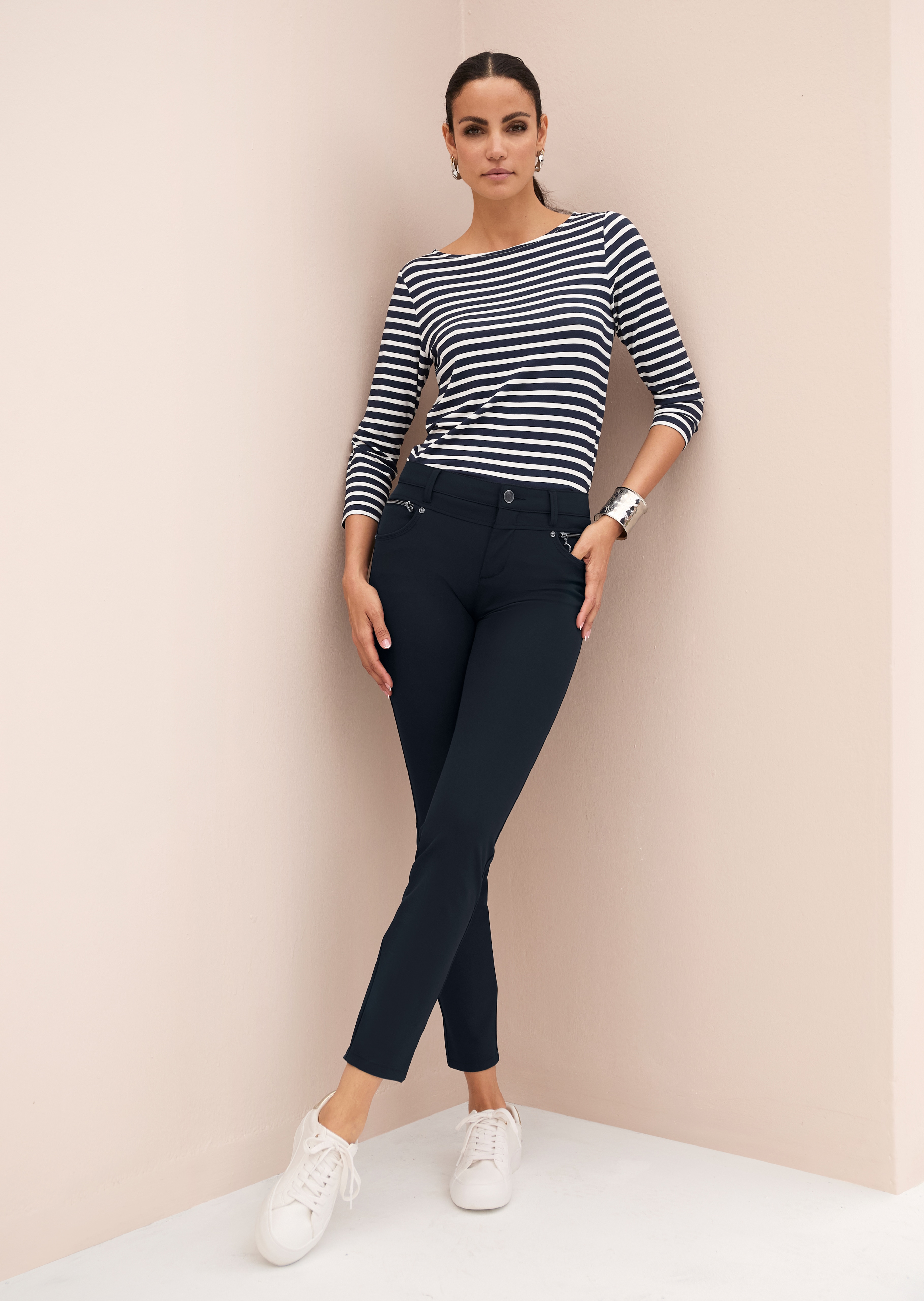 Stretch trousers with decorative zips