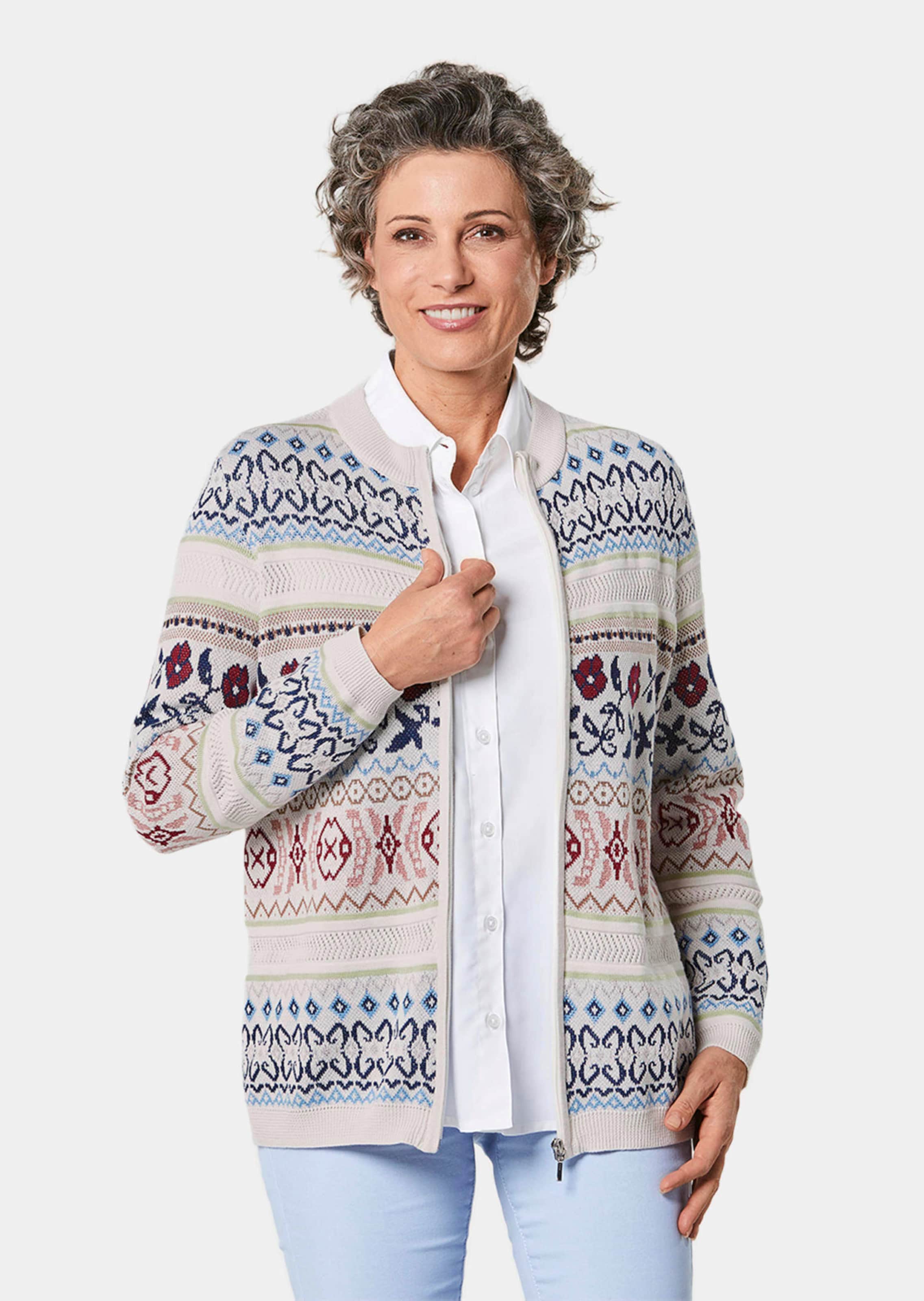 Schitterend tricot jasje met ajourpatroon