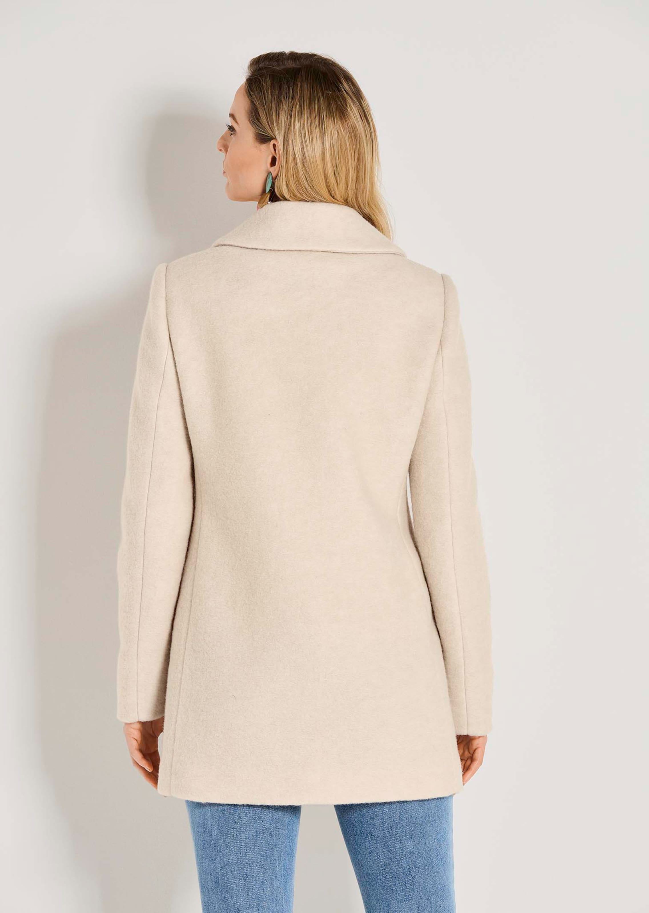 Wool-blend short coat in pearl white | MADELEINE Fashion