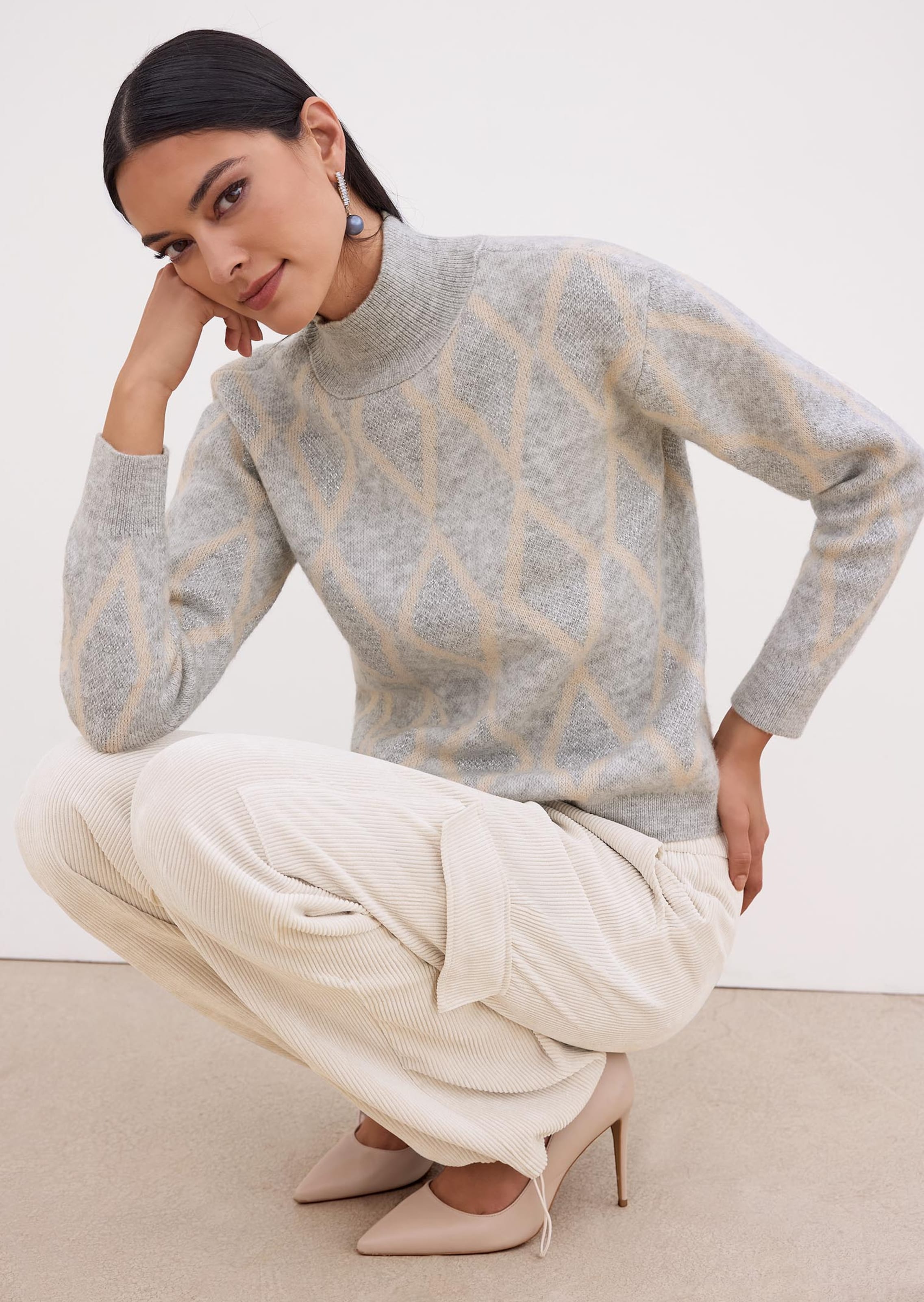 Glinsterende pullover met ruitpatroon