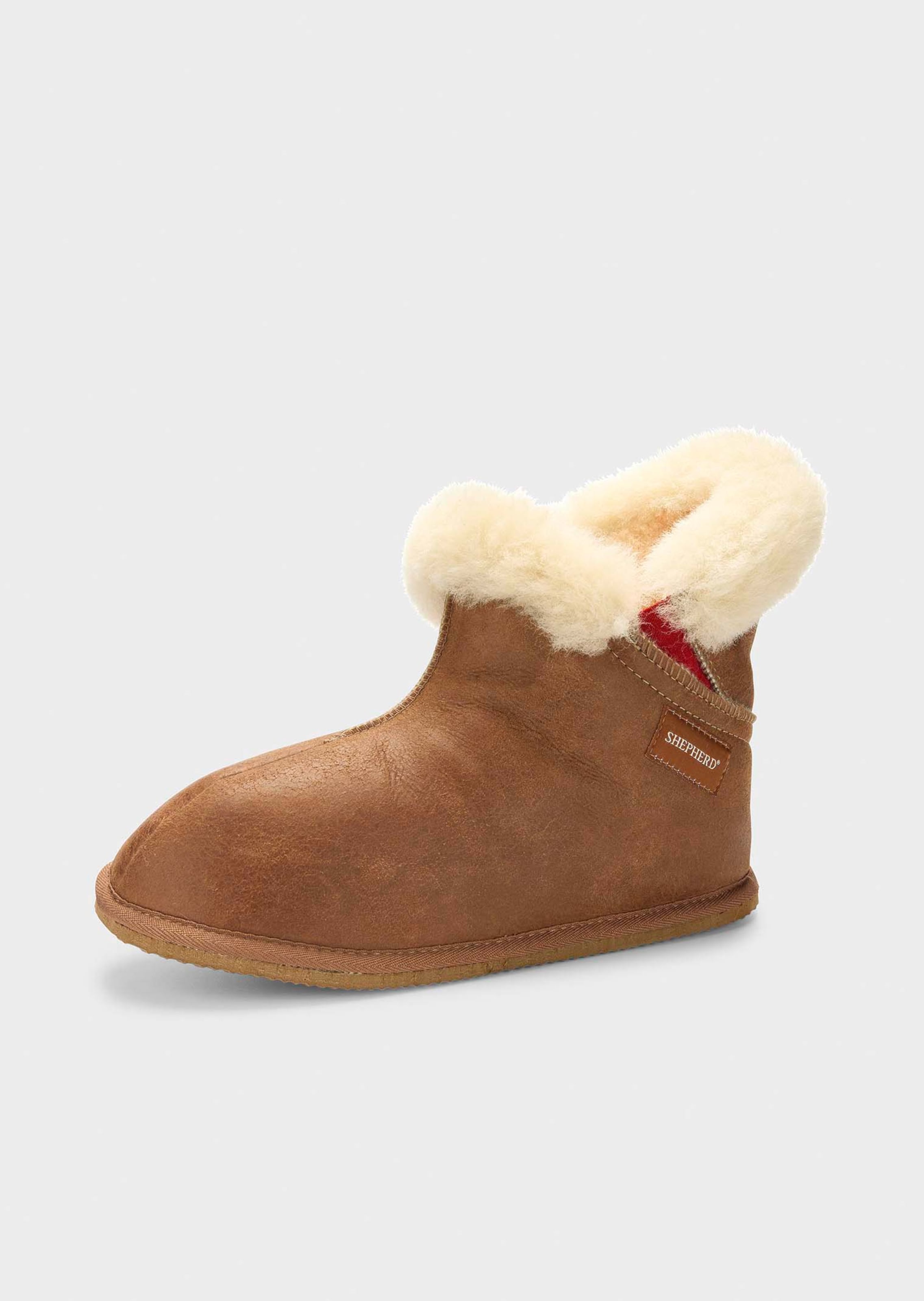 Pantoffels van lamsvacht met hoge schacht