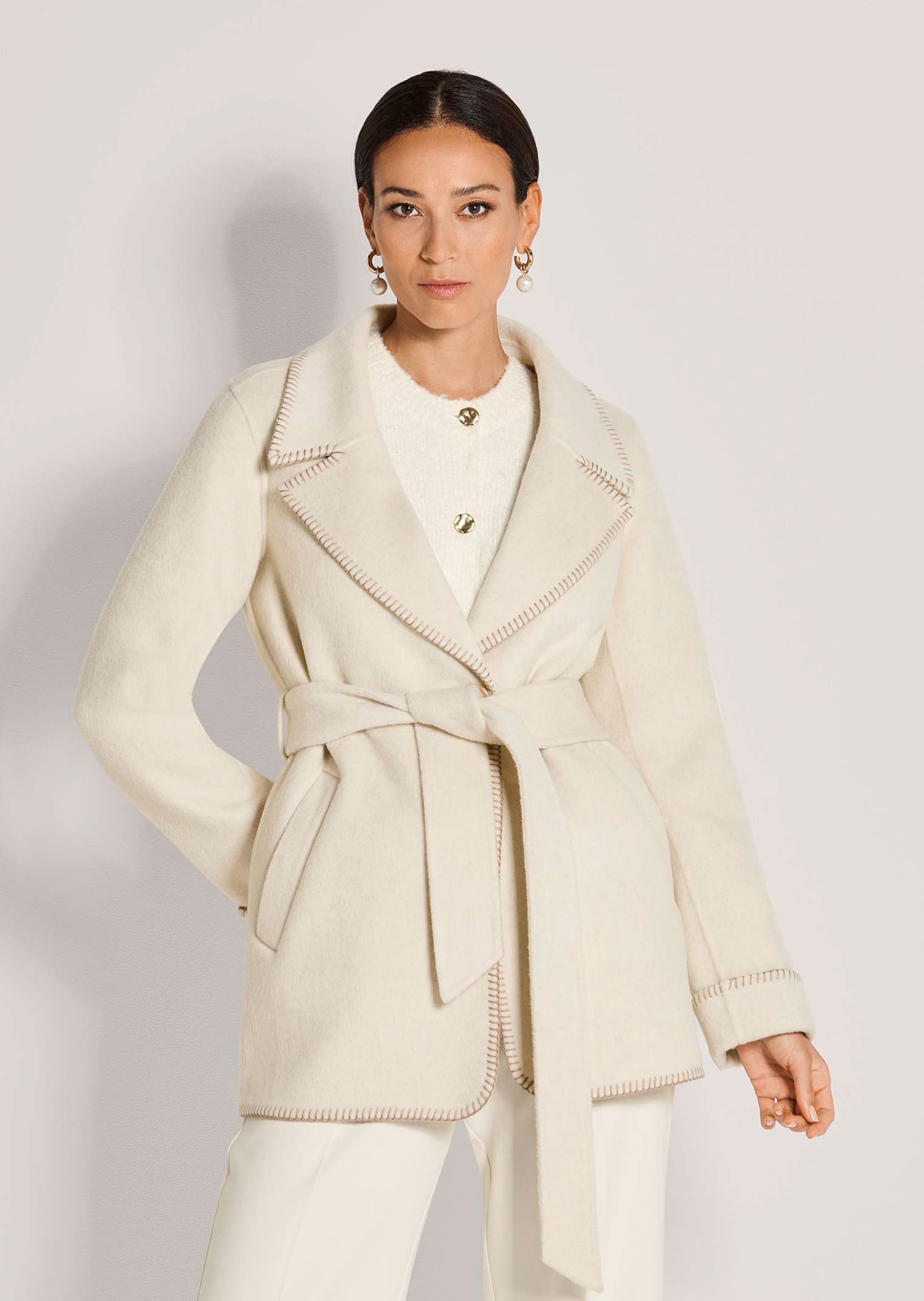 Double-faced coat with tie belt and hand-stitched edge