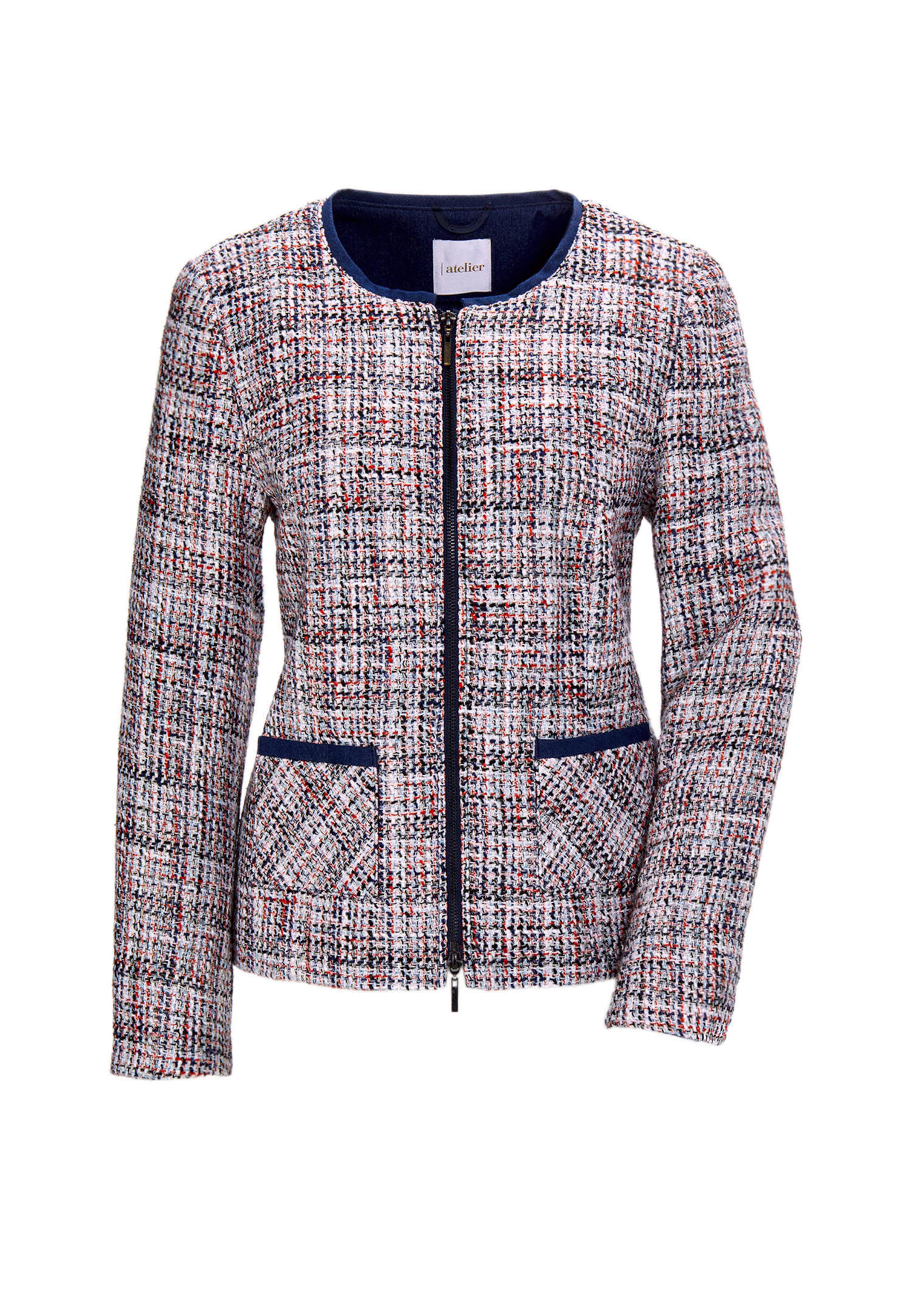 Chique boucléblazer met biesjes van denim