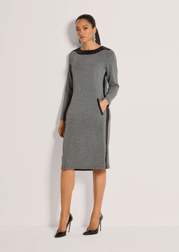 Kokerjurk met lederlook afwerking
