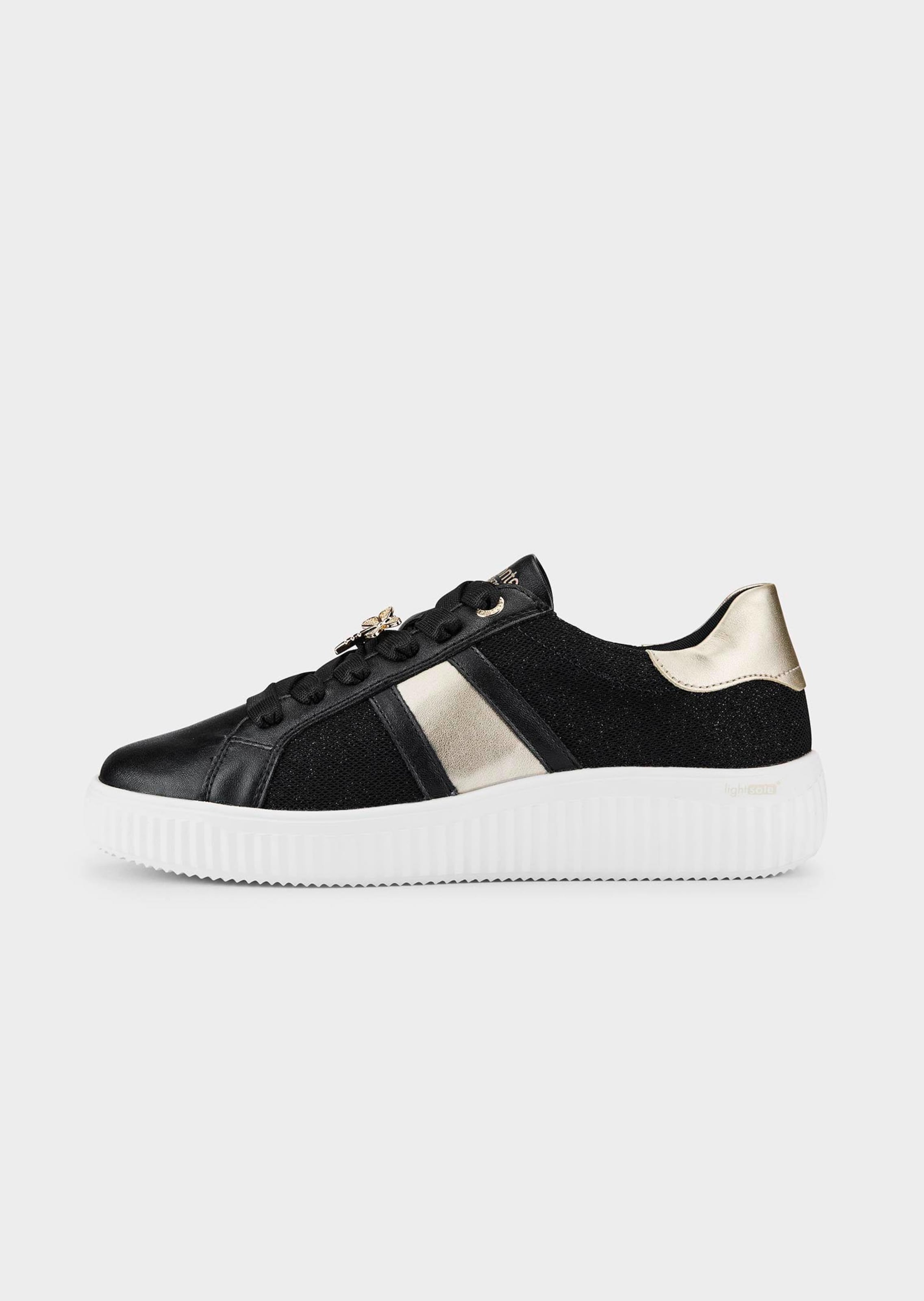 Sneaker mit Glanzelementen