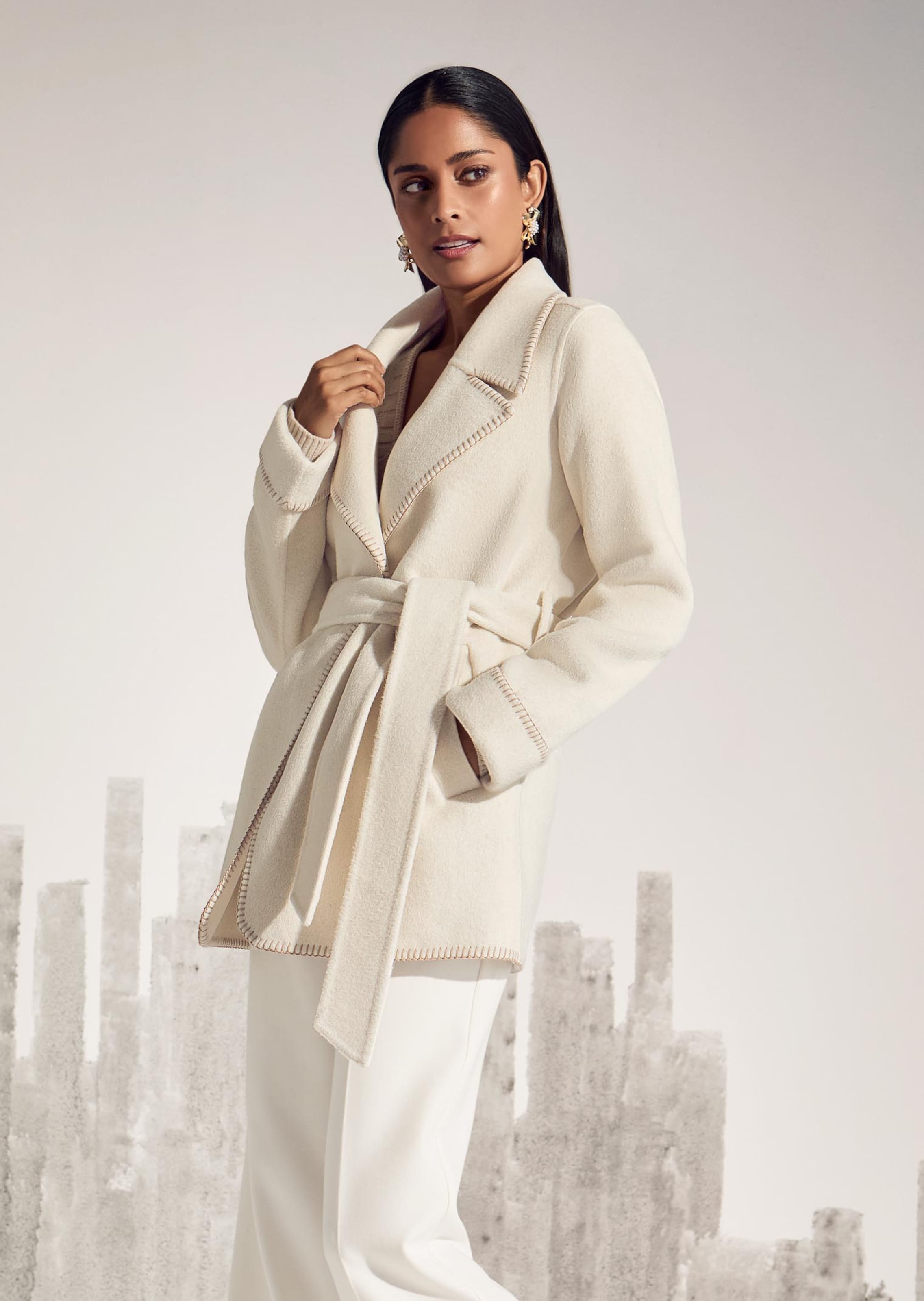 Double-faced coat with tie belt and hand-stitched edge