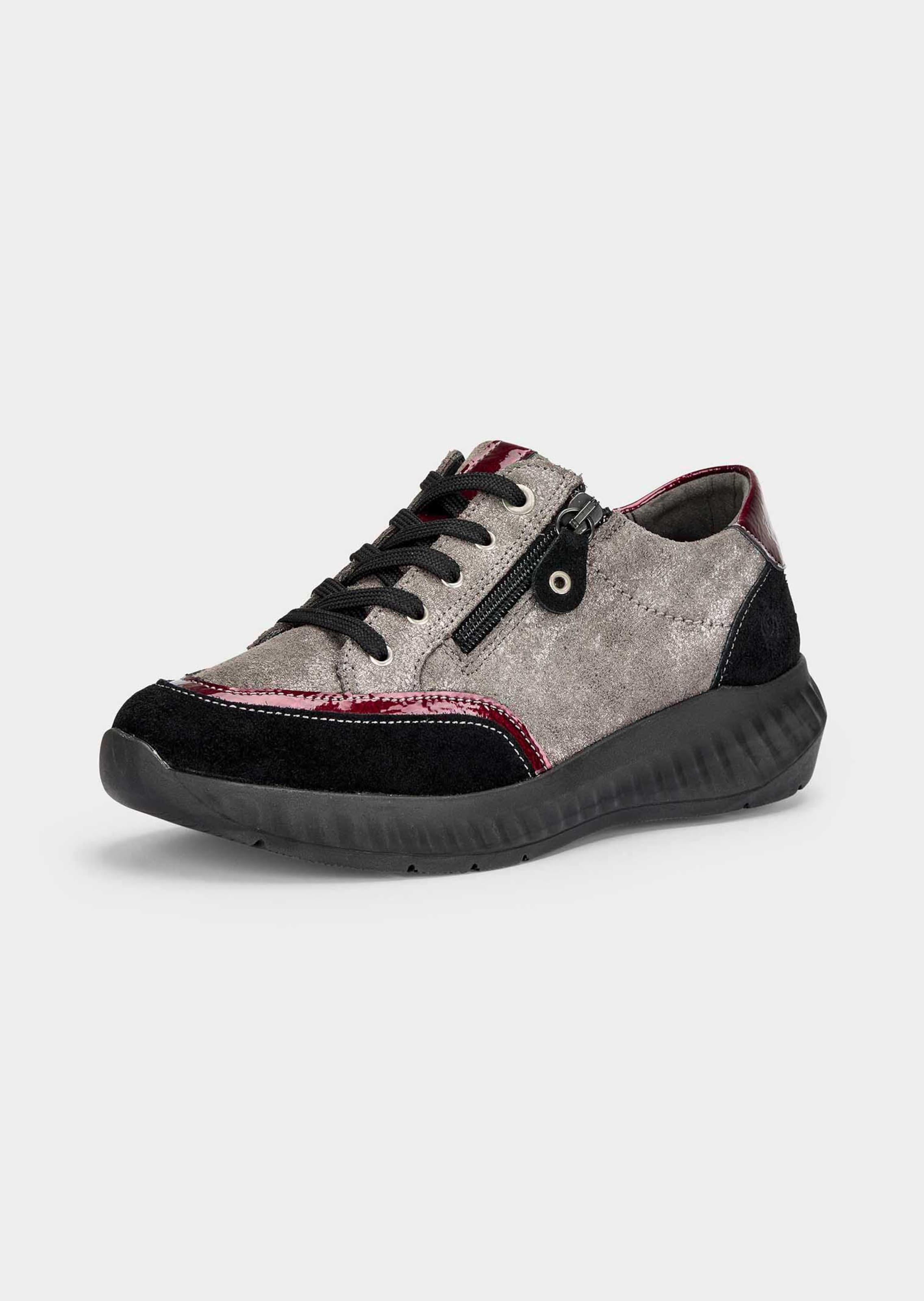 Sneakers avec détails vernis tendance