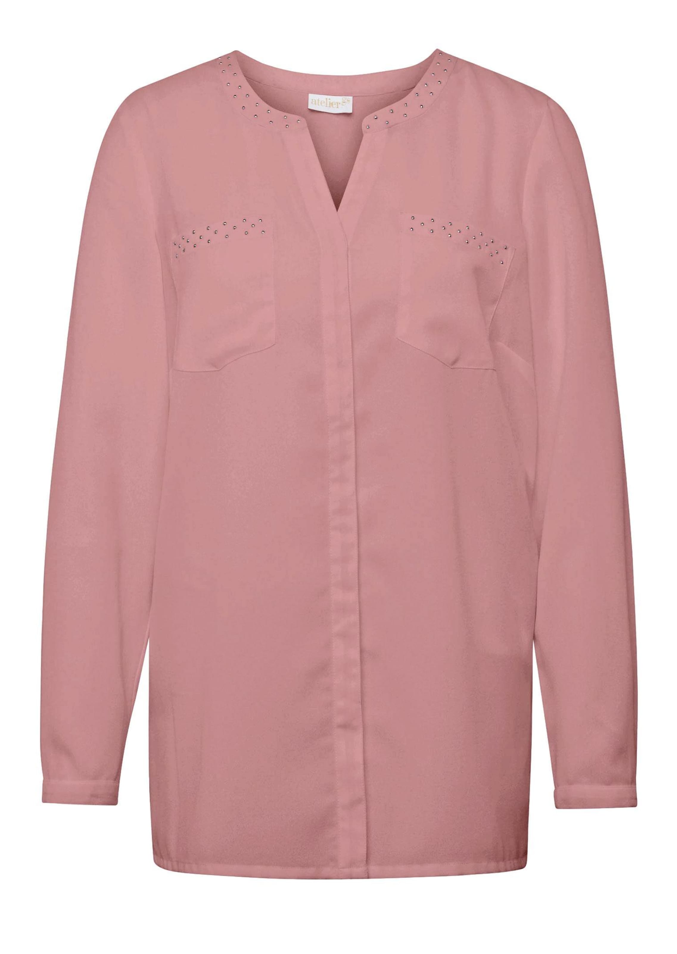 Modische Bluse mit Taschen und Schmucksteinen