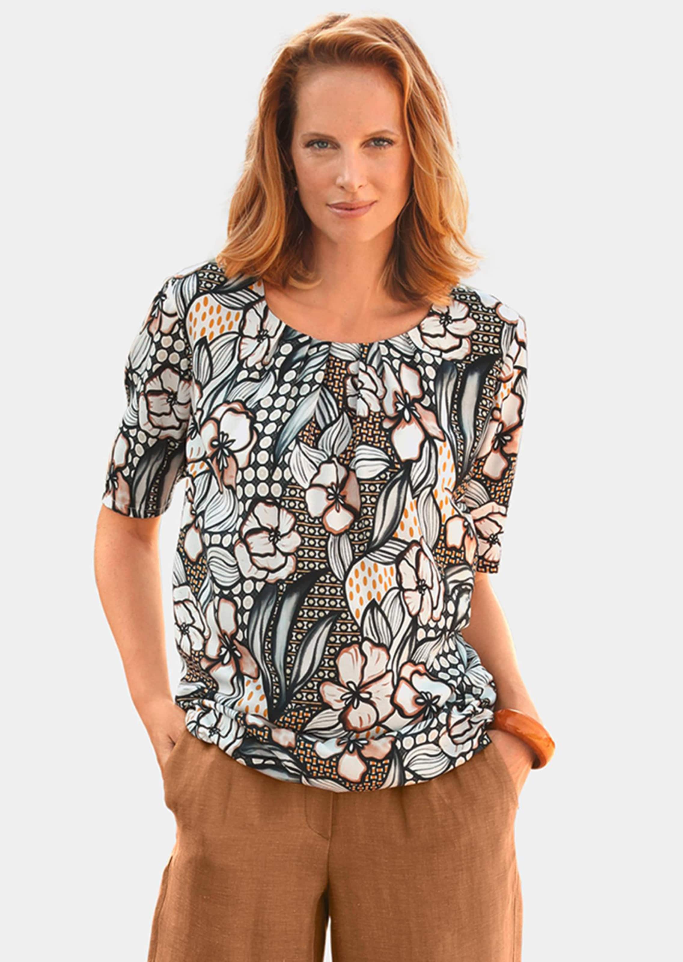 Vrouwelijke gedessineerde blouse met ronde hals