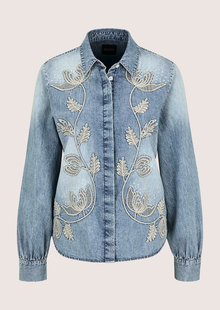 Denim blouse featuring floral embroidery