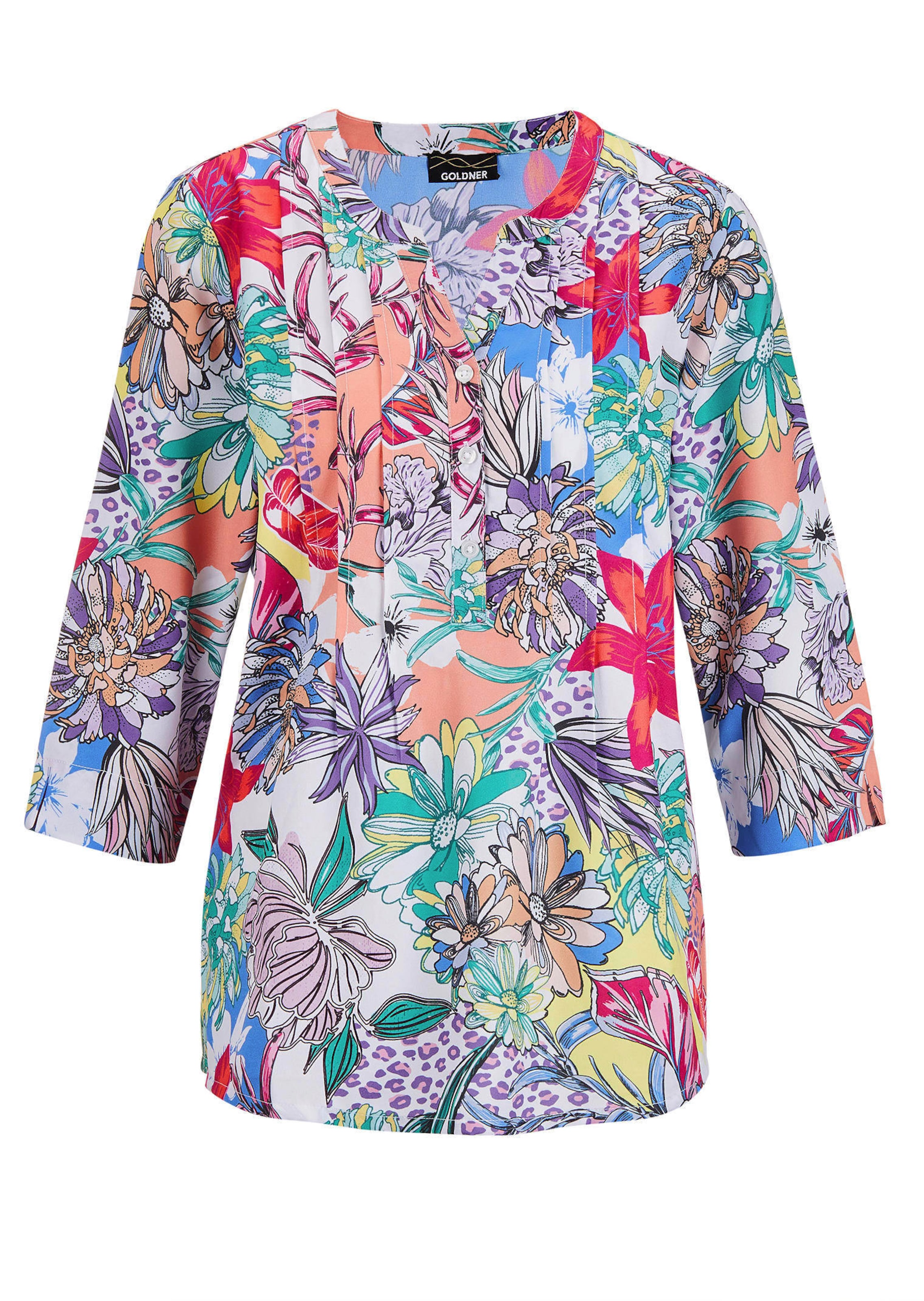 Helder gekleurde, gedessineerde blouse met charmante details