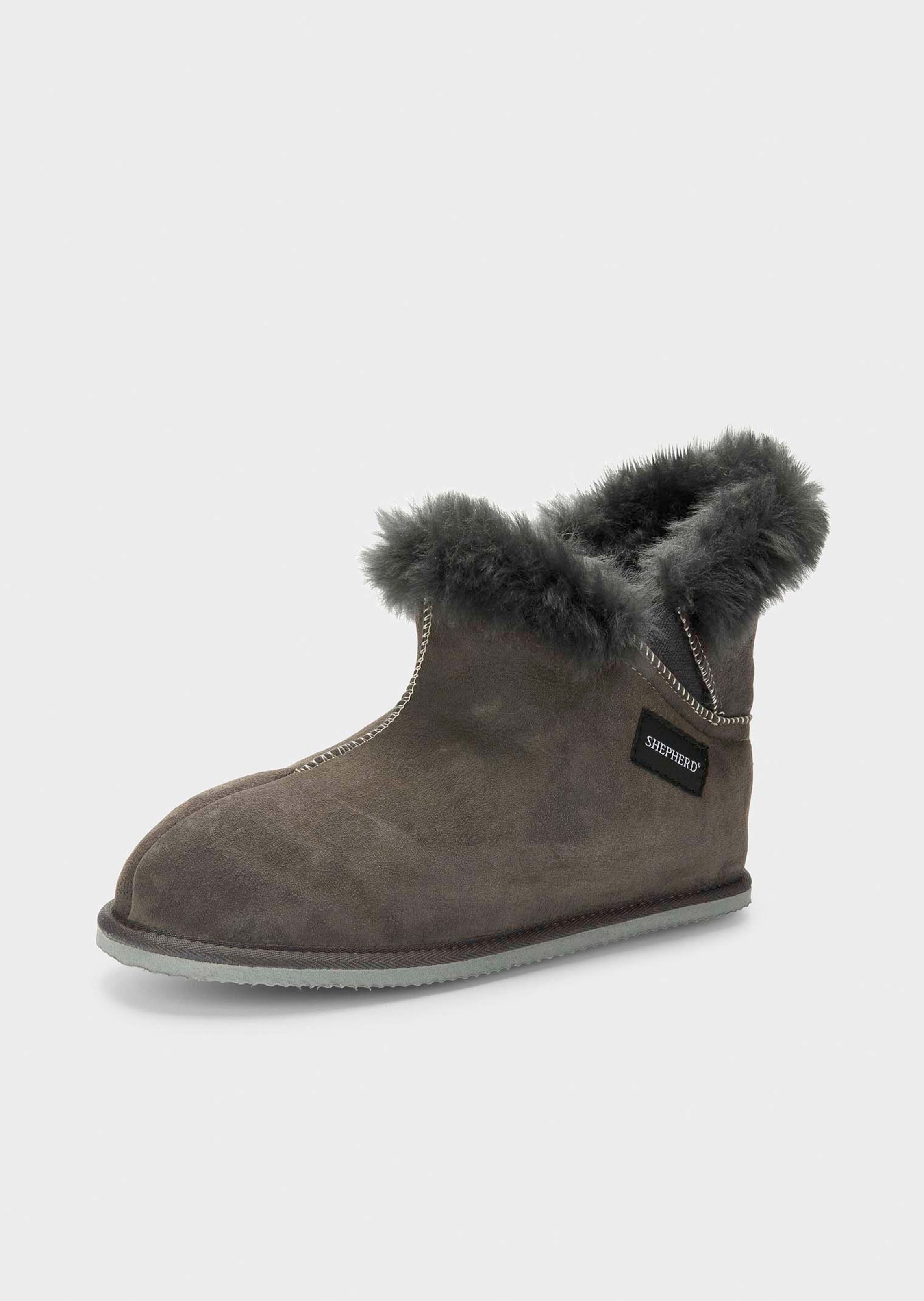 Pantoffels van lamsvacht met hoge schacht