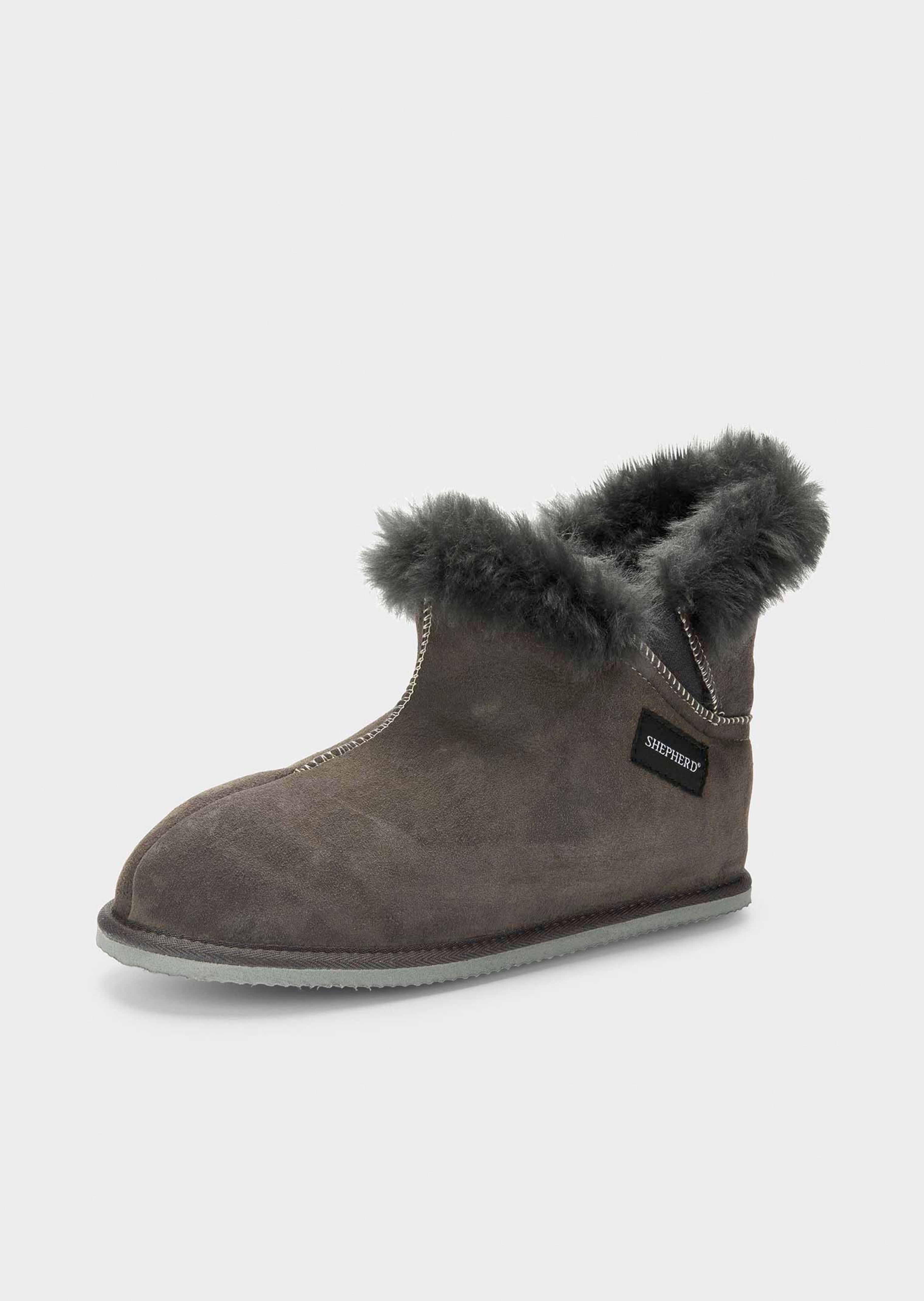 Pantoffels van lamsvacht met hoge schacht