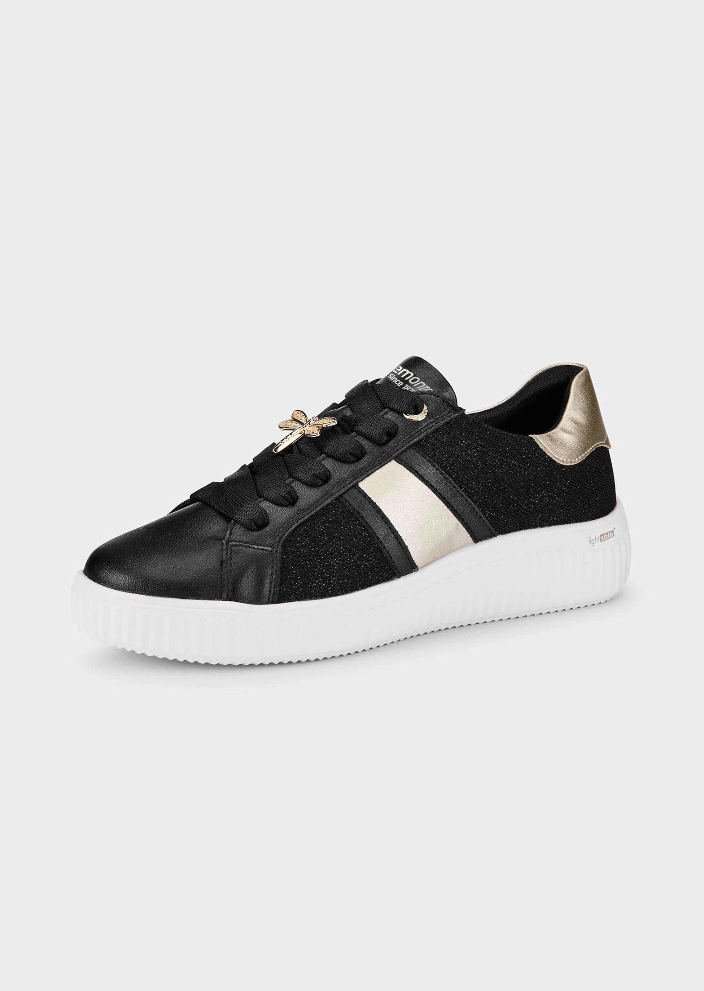 Sneaker mit Glanzelementen
