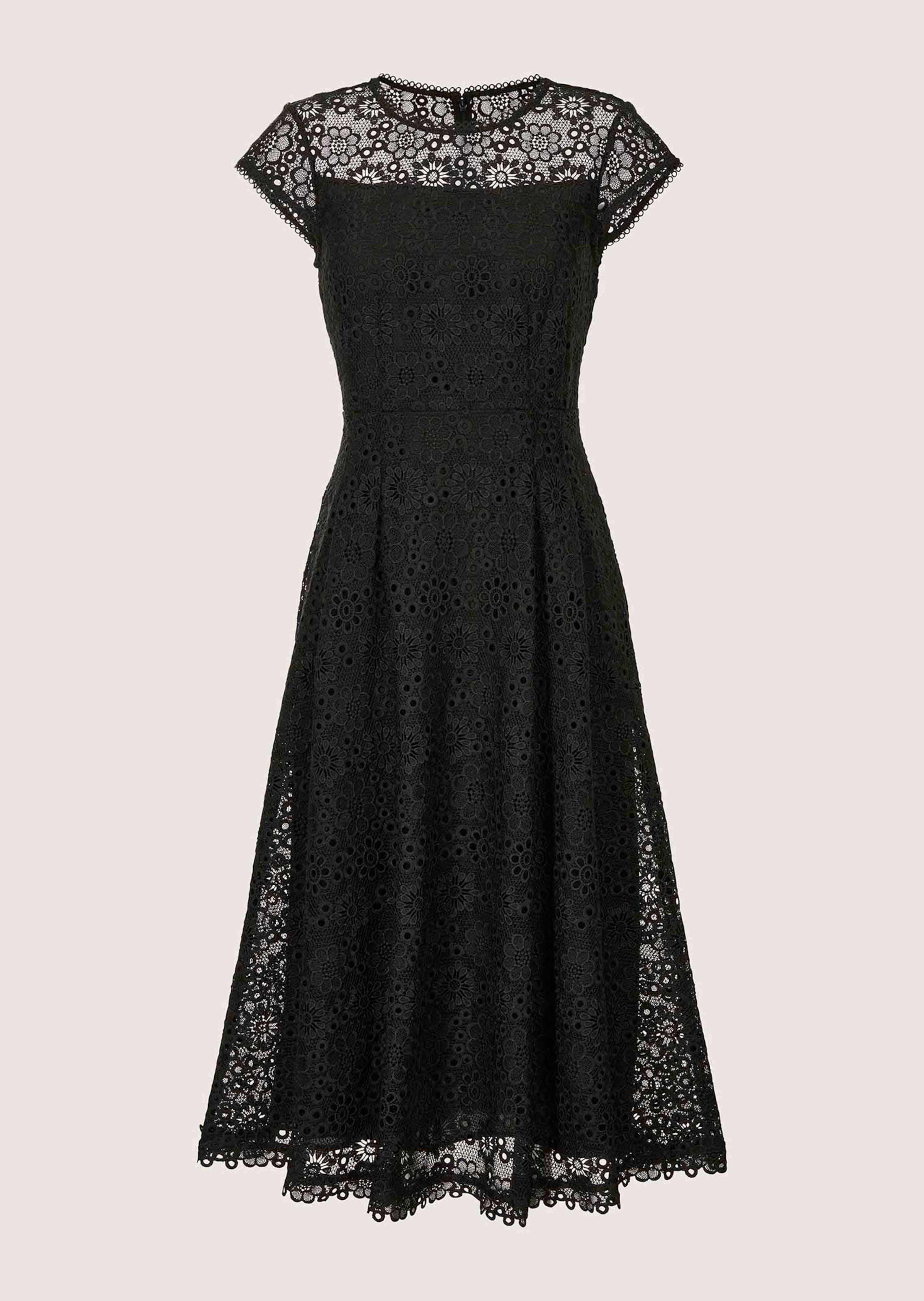 Sleeveless lace dress with tie ribbon and wide skirt